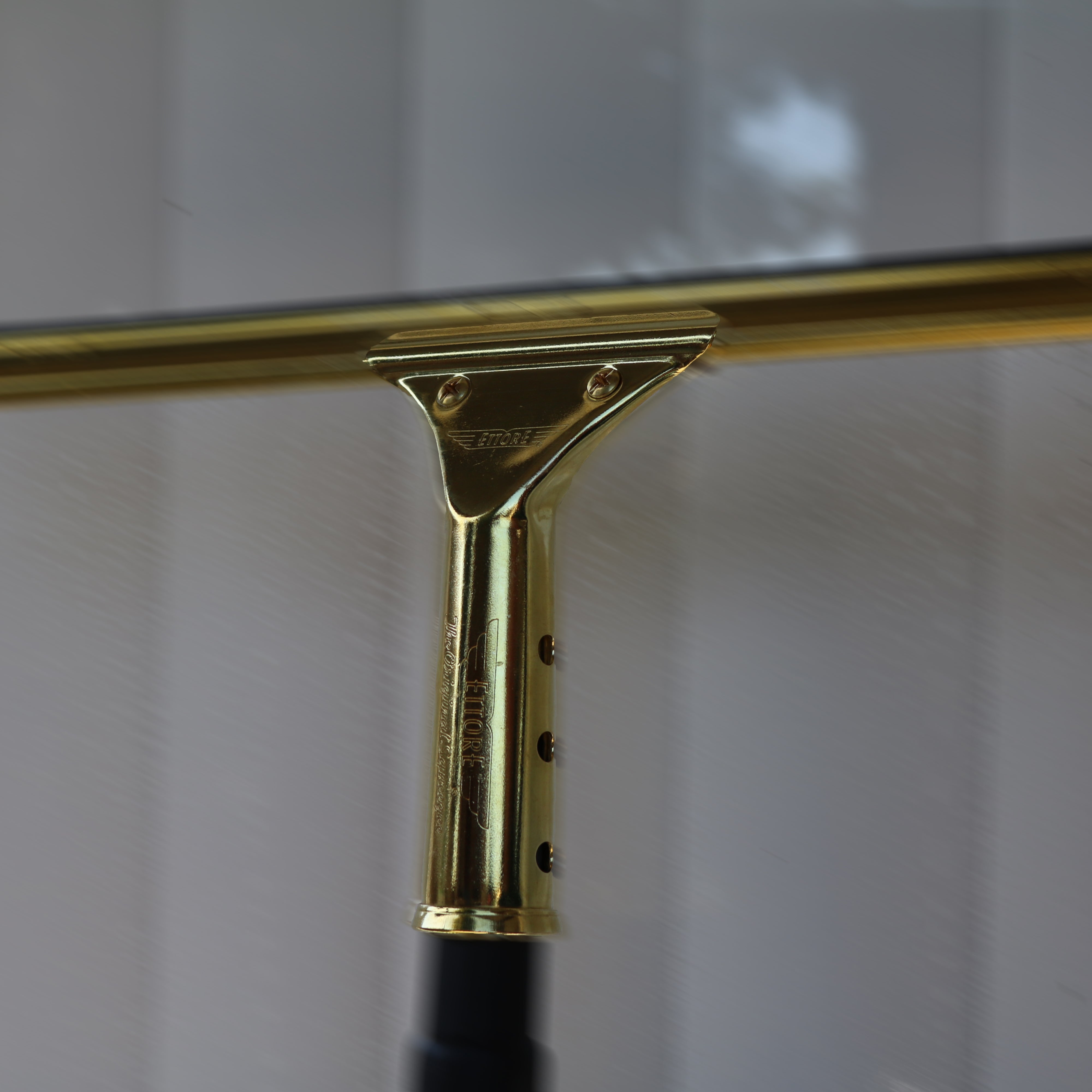 Master Brass Squeegee Cleaning Window